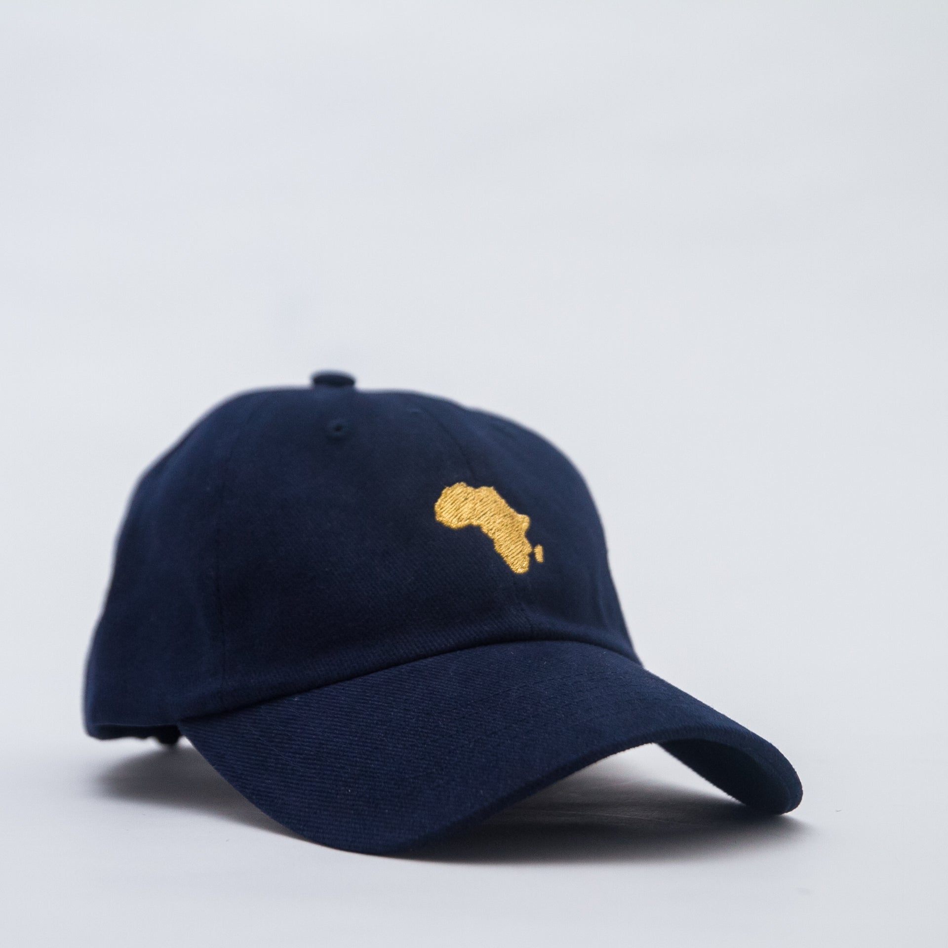 Africa Forever Original navy baseball/dad hat with our signature Embroidery gold logo. One size fit all and adjustable strap.  Represent Africa anytime you put on this classic cap. 